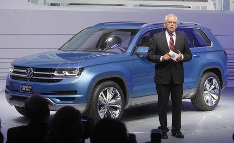 Dr. Ulrich Hackenberg, Member of the Board, Volkswagen Brand, speaks next to the 2014 Touran Cross Blue at the North American International Dr. Ulrich Hackenberg, Member of the Board, Volkswagen Brand, speaks next to the 2014 Touran Cross Blue at the North American International