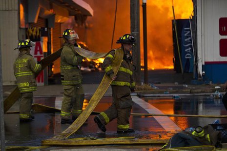 New Jersey firefighters arrive to control a massive fire in Seaside Park in New Jersey September 12, 2013. REUTERS/Eduardo Munoz New Jersey firefighters arrive to control a massive fire in Seaside Park in New Jersey September 12, 2013. REUTERS/Eduardo Munoz