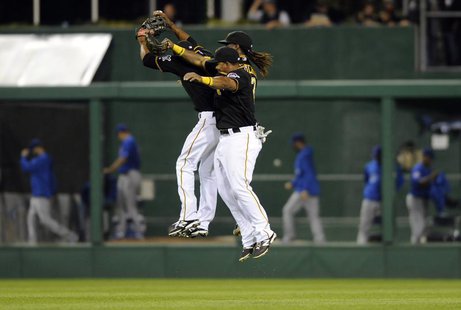 Pittsburgh Pirates' Felix Pie, Andrew McCutchen (R) and Marlon Byrd (front) celebrate their victory over the Chicago Cubs after their Nation Pittsburgh Pirates' Felix Pie, Andrew McCutchen (R) and Marlon Byrd (front) celebrate their victory over the Chicago Cubs after their Nation