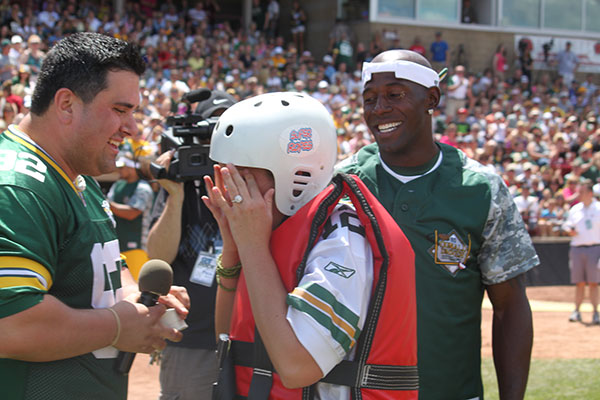 On field marriage proposal at Donald Driver Softball Game