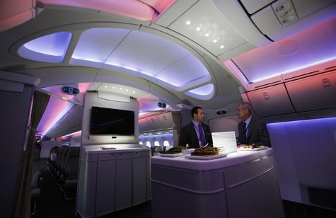 Mark Jenks (R), Boeing's vice president of 787-9 development, speaks to an executive along the archway of the 787 Dreamliner during a demons Mark Jenks (R), Boeing's vice president of 787-9 development, speaks to an executive along the archway of the 787 Dreamliner during a demons