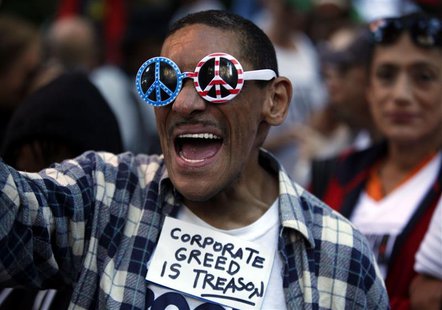 An Occupy Wall Street protester chants slogans along 47th Street in New York September 17, 2013. REUTERS/Joshua Lott An Occupy Wall Street protester chants slogans along 47th Street in New York September 17, 2013. REUTERS/Joshua Lott