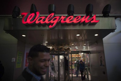 Shoppers walk by at the Walgreens' Times Square store in New York December 17, 2012. REUTERS/Andrew Kelly Shoppers walk by at the Walgreens' Times Square store in New York December 17, 2012. REUTERS/Andrew Kelly