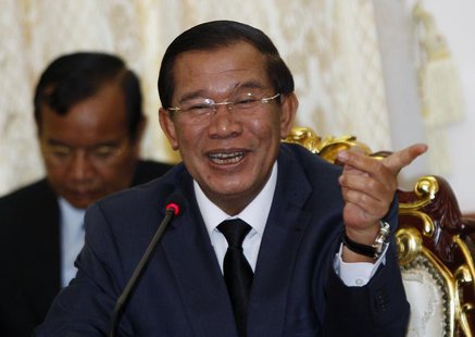 Cambodian Prime Minister Hun Sen smiles during a meeting with Sam Rainsy, president of the Cambodia National Rescue Party (CNRP), at Cambodi Cambodian Prime Minister Hun Sen smiles during a meeting with Sam Rainsy, president of the Cambodia National Rescue Party (CNRP), at Cambodi