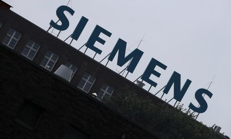 The logo of Siemens AG is seen atop a factory in Berlin July 29, 2013. REUTERS/Fabrizio Bensch The logo of Siemens AG is seen atop a factory in Berlin July 29, 2013. REUTERS/Fabrizio Bensch