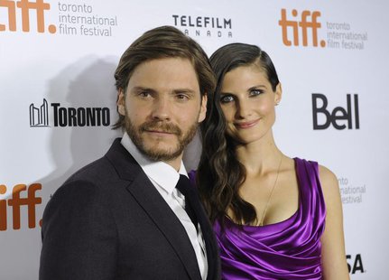 Cast member Daniel Bruehl poses on the red carpet with girlfriend Felicitas Rombold before a screening of the film "Rush" at Roy Thomson Hal Cast member Daniel Bruehl poses on the red carpet with girlfriend Felicitas Rombold before a screening of the film "Rush" at Roy Thomson Hal