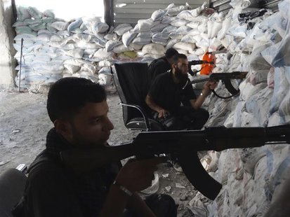 Free Syrian Army fighters take up shooting positions on one of the battlefronts in Jobar, Damascus September 16, 2013. Picture taken Septemb Free Syrian Army fighters take up shooting positions on one of the battlefronts in Jobar, Damascus September 16, 2013. Picture taken Septemb