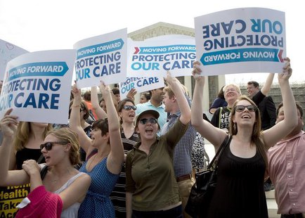 Supporters of the Affordable Healthcare Act celebrate in front of the Supreme Court after the court upheld the legality of the law in Washin Supporters of the Affordable Healthcare Act celebrate in front of the Supreme Court after the court upheld the legality of the law in Washin