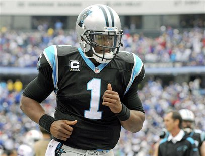 Carolina Panthers quarterback Cam Newton jogs off the field after being defeated by the Buffalo Bills in their NFL football game in Orchard Carolina Panthers quarterback Cam Newton jogs off the field after being defeated by the Buffalo Bills in their NFL football game in Orchard