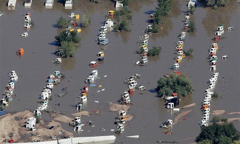 Rows of vehicles lie flooded in Weld County, Colorado September 17, 2013. REUTERS/Rick Wilking Rows of vehicles lie flooded in Weld County, Colorado September 17, 2013. REUTERS/Rick Wilking