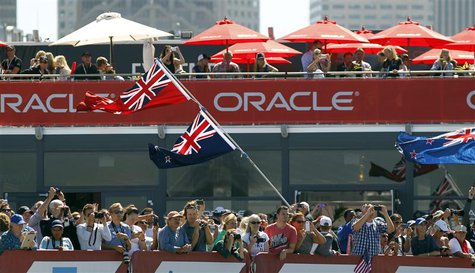 Fans of Emirates Team New Zealand cheer after their team defeated Oracle Team USA during Race 11 of the 34th America's Cup yacht sailing rac Fans of Emirates Team New Zealand cheer after their team defeated Oracle Team USA during Race 11 of the 34th America's Cup yacht sailing rac