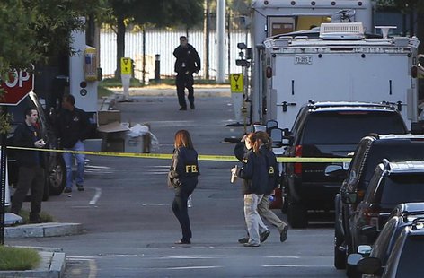 Investigators continue to work the scene at the Navy Yard two days after a gunman killed 12 people before police shot him dead, in Washingto Investigators continue to work the scene at the Navy Yard two days after a gunman killed 12 people before police shot him dead, in Washingto
