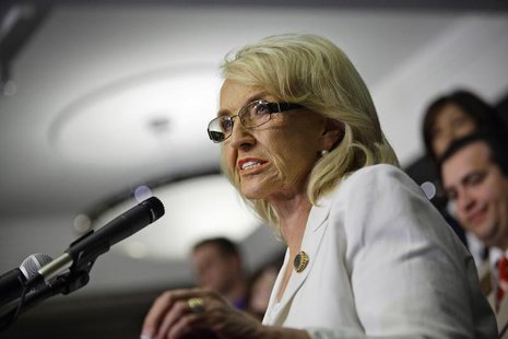 Arizona Governor Jan Brewer speaks after signing an expansion of the state's Medicaid program into law, at the Arizona State Capitol in Phoe Arizona Governor Jan Brewer speaks after signing an expansion of the state's Medicaid program into law, at the Arizona State Capitol in Phoe