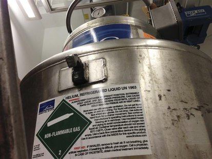 A helium dewar holding 250 liters of helium at -269 degrees Celsius (4.2 Kelvin (4.2 degrees above absolute zero or -452.2 degrees Fahrenhei A helium dewar holding 250 liters of helium at -269 degrees Celsius (4.2 Kelvin (4.2 degrees above absolute zero or -452.2 degrees Fahrenhei