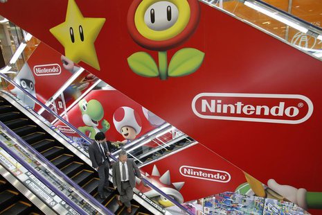 Men ride an escalator past Nintendo Co advertisements at an electronics retail store in Tokyo April 23, 2013. REUTERS/Toru Hanai Men ride an escalator past Nintendo Co advertisements at an electronics retail store in Tokyo April 23, 2013. REUTERS/Toru Hanai