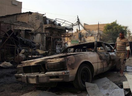 A man looks at a damaged vehicle a day after a bomb attack in Baghdad, in this file picture taken September 16, 2013. REUTERS/Ahmed Saad/Fil A man looks at a damaged vehicle a day after a bomb attack in Baghdad, in this file picture taken September 16, 2013. REUTERS/Ahmed Saad/Fil