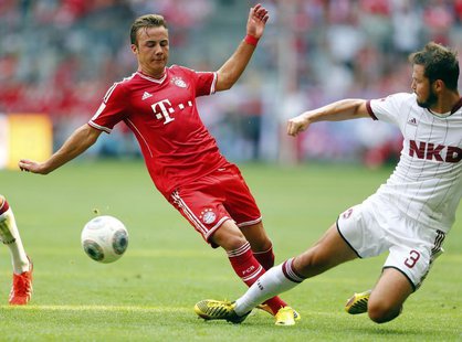 Mario Goetze (L) of FC Bayern Munich is challenged by Per Nilsson of FC Nuremberg during their German first division Bundesliga soccer match Mario Goetze (L) of FC Bayern Munich is challenged by Per Nilsson of FC Nuremberg during their German first division Bundesliga soccer match