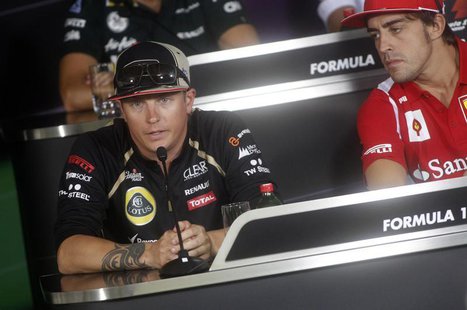 Ferrari Formula One driver Fernando Alonso (R) of Spain and Lotus Formula One driver Kimi Raikkonen of Finland attend a news conference ahea Ferrari Formula One driver Fernando Alonso (R) of Spain and Lotus Formula One driver Kimi Raikkonen of Finland attend a news conference ahea