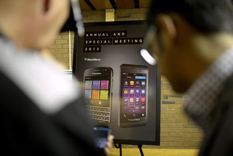 BlackeBerry users look at a new mobile device at the BlackBerry Annual and Special Meeting in Waterloo, Ontario July 9, 2013. REUTERS/Jon Bl BlackeBerry users look at a new mobile device at the BlackBerry Annual and Special Meeting in Waterloo, Ontario July 9, 2013. REUTERS/Jon Bl