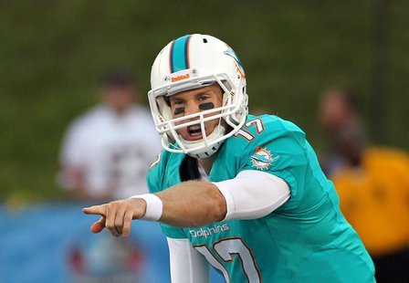 Miami Dolphins quarterback Ryan Tannehill points out directions at the line of scrimmage during the first quarter of the NFL Hall of Fame Ga Miami Dolphins quarterback Ryan Tannehill points out directions at the line of scrimmage during the first quarter of the NFL Hall of Fame Ga