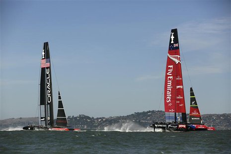 Emirates Team New Zealand (R) sails ahead of Oracle Team USA during Race 12 of the 34th America's Cup yacht sailing race in San Francisco, C Emirates Team New Zealand (R) sails ahead of Oracle Team USA during Race 12 of the 34th America's Cup yacht sailing race in San Francisco, C