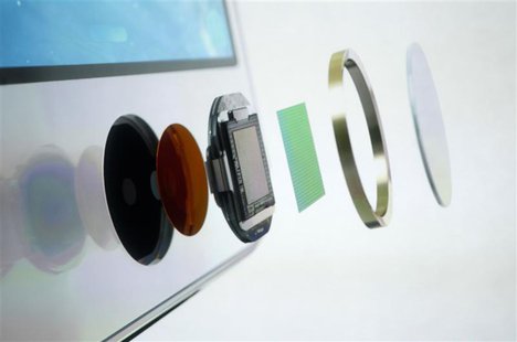 The exploded view of the home button which doubles as a fingerprint sensor is seen on an image of the new iPhone 5S at Apple Inc's media eve The exploded view of the home button which doubles as a fingerprint sensor is seen on an image of the new iPhone 5S at Apple Inc's media eve