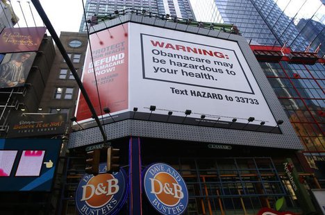 A billboard on West 42nd Street between 7th and 8th Avenues advertising the defunding of "Obamacare" the Affordable Care Act (ACA), paid for A billboard on West 42nd Street between 7th and 8th Avenues advertising the defunding of "Obamacare" the Affordable Care Act (ACA), paid for