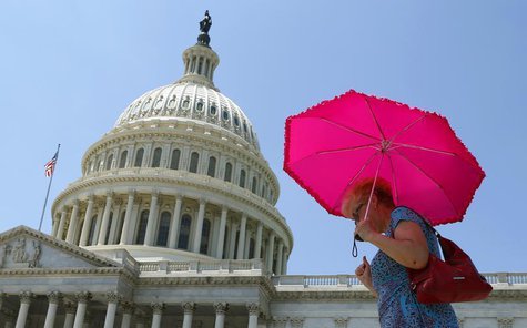 A woman holds an umbrella against the hot sun as she walks in front of the U.S. Capitol in Washington July 16 , 2013. REUTERS/Kevin Lamarque A woman holds an umbrella against the hot sun as she walks in front of the U.S. Capitol in Washington July 16 , 2013. REUTERS/Kevin Lamarque