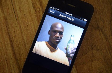 A photo of Aaron Alexis, 34, the suspected shooter who was among 13 people killed in the shooting at Washington Navy Yard, is displayed on t A photo of Aaron Alexis, 34, the suspected shooter who was among 13 people killed in the shooting at Washington Navy Yard, is displayed on t
