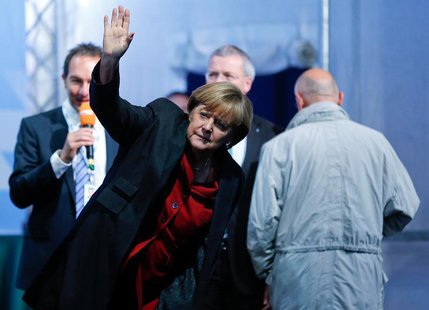 German Chancellor Angela Merkel arrives for a Christian Democratic Union election campaign meeting in Augsburg September 19, 2013. REUTERS/M German Chancellor Angela Merkel arrives for a Christian Democratic Union election campaign meeting in Augsburg September 19, 2013. REUTERS/M