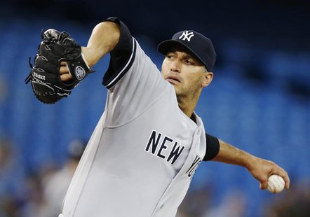 New York Yankees Andy Pettitte pitches to the Toronto Blue Jays during the first inning of their MLB American League baseball game in Toront New York Yankees Andy Pettitte pitches to the Toronto Blue Jays during the first inning of their MLB American League baseball game in Toront