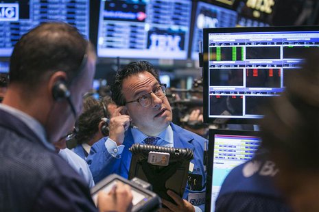 Traders work on the floor of the New York Stock Exchange shortly after the opening of the market in New York September 20, 2013. REUTERS/Luc Traders work on the floor of the New York Stock Exchange shortly after the opening of the market in New York September 20, 2013. REUTERS/Luc