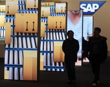 People are pictured beside screens at the booth of German company SAP during preparations at the CeBit computer fair in Hanover in this March, 4, 2012 file picture.
REUTERS/Fabian Bimmer People are pictured beside screens at the booth of German company SAP during preparations at the CeBit computer fair in Hanover in this March, 4, 2012 file picture.
REUTERS/Fabian Bimmer
