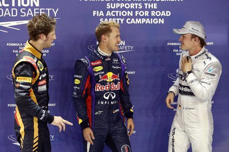 Lotus F1 Formula One driver Romain Grosjean of France (L), Red Bull Formula One driver Sebastian Vettel of Germany (C) and Mercedes Formula Lotus F1 Formula One driver Romain Grosjean of France (L), Red Bull Formula One driver Sebastian Vettel of Germany (C) and Mercedes Formula