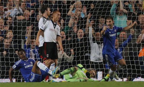 Chelsea's John Obi Mikel (L) celebrates scoring his goal against Fulham with Branislav Ivanovic (R) during their English Premier League socc Chelsea's John Obi Mikel (L) celebrates scoring his goal against Fulham with Branislav Ivanovic (R) during their English Premier League socc