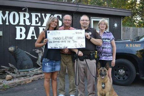 PHOTO - From left to right: Brenda Cote, owner of Morey’s Bar, Mark Czech, Deputy Daniel Wachowiak, and Annette Glodowski – along with Baco.
PHOTO - From left to right: Brenda Cote, owner of Morey’s Bar, Mark Czech, Deputy Daniel Wachowiak, and Annette Glodowski – along with Baco.