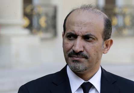 Ahmad Jarba, head of the opposition Syrian National Coalition, speaks to journalists in the courtyard of the Elysee Palace after a meeting w Ahmad Jarba, head of the opposition Syrian National Coalition, speaks to journalists in the courtyard of the Elysee Palace after a meeting w