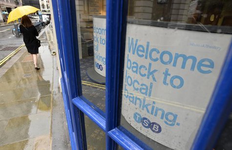 A pedestrian walks past a branch of the TSB bank in central London September 9, 2013. REUTERS/Toby Melville A pedestrian walks past a branch of the TSB bank in central London September 9, 2013. REUTERS/Toby Melville