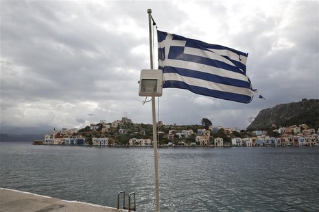 A Greek flag flutters at the port of the Greek southeastern island of Kastelorizo April 15, 2013. Picture taken April 15, 2013. REUTERS/Yorg A Greek flag flutters at the port of the Greek southeastern island of Kastelorizo April 15, 2013. Picture taken April 15, 2013. REUTERS/Yorg