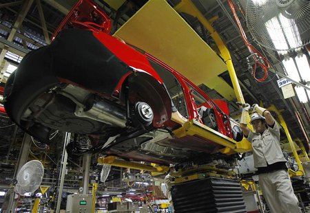 An employee works at an assembly line in AutoAlliance Thailand, a Ford and Mazda joint venture plant, located in Rayong province, east of Ba An employee works at an assembly line in AutoAlliance Thailand, a Ford and Mazda joint venture plant, located in Rayong province, east of Ba