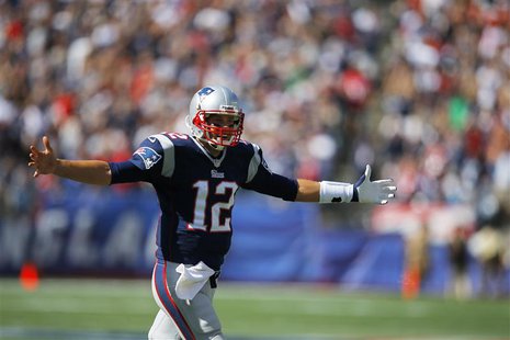 New England Patriots quarterback Tom Brady celebrates after the Patriots scored a touchdown on a pass to Patriots wide receiver Kenbrell Tho New England Patriots quarterback Tom Brady celebrates after the Patriots scored a touchdown on a pass to Patriots wide receiver Kenbrell Tho