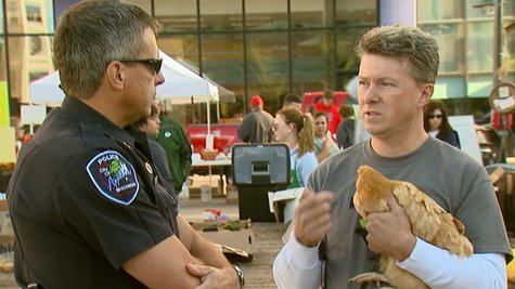A man holds a chicken illegally at the Appleton Farm Market on Saturday, September 21, 2013. He and others protested the illegality of having livestock in public, but the legality of carrying firearms in public. (Photo by: FOX 11). A man holds a chicken illegally at the Appleton Farm Market on Saturday, September 21, 2013. He and others protested the illegality of having livestock in public, but the legality of carrying firearms in public. (Photo by: FOX 11).