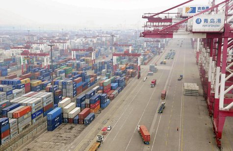 Trucks are used to transport containers at a port in Qingdao, Shandong province July 10, 2013. REUTERS/China Daily Trucks are used to transport containers at a port in Qingdao, Shandong province July 10, 2013. REUTERS/China Daily