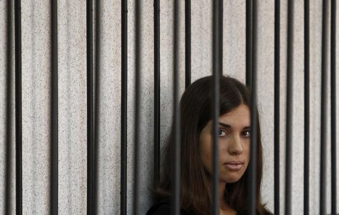 Member of the female punk band "Pussy Riot" Nadezhda Tolokonnikova looks out from a holding cell as she attends a court hearing to appeal fo Member of the female punk band "Pussy Riot" Nadezhda Tolokonnikova looks out from a holding cell as she attends a court hearing to appeal fo