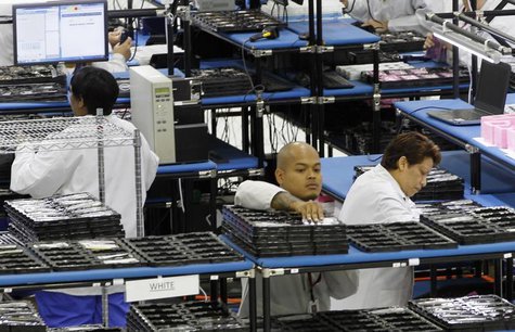 Workers assemble Motorola phones at the Flextronics plant that will be building the new Motorola smart phone "MotoX" in Fort Worth, Texas Se Workers assemble Motorola phones at the Flextronics plant that will be building the new Motorola smart phone "MotoX" in Fort Worth, Texas Se