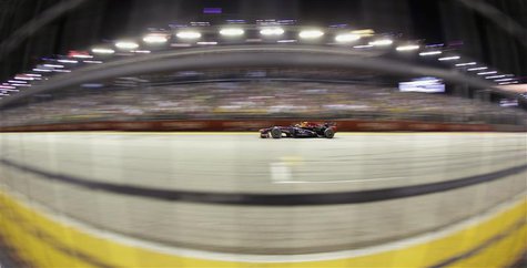 Red Bull Formula One driver Sebastian Vettel of Germany races during the Singapore Grand Prix September 22, 2013. REUTERS/Pablo Sanchez Red Bull Formula One driver Sebastian Vettel of Germany races during the Singapore Grand Prix September 22, 2013. REUTERS/Pablo Sanchez
