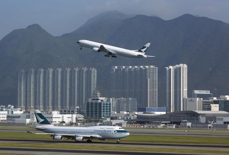 A Cathay Pacific Airways passenger plane takes off at the Hong Kong Airport September 11, 2013. REUTERS/Tyrone Siu A Cathay Pacific Airways passenger plane takes off at the Hong Kong Airport September 11, 2013. REUTERS/Tyrone Siu