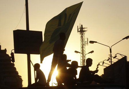 Members of the Muslim Brotherhood and supporters of ousted Egyptian President Mohamed Mursi form silhouettes during a protest against the mi Members of the Muslim Brotherhood and supporters of ousted Egyptian President Mohamed Mursi form silhouettes during a protest against the mi
