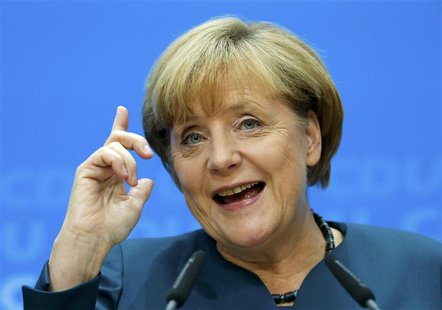 German Chancellor and leader of the Christian Democratic Union ( CDU) Angela Merkel, gestures during a news conference after a CDU party boa German Chancellor and leader of the Christian Democratic Union ( CDU) Angela Merkel, gestures during a news conference after a CDU party boa
