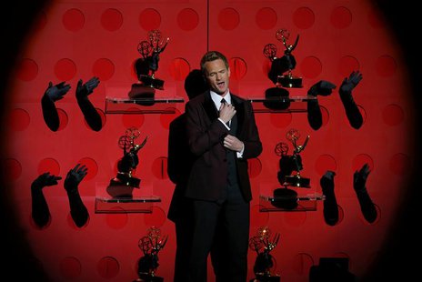 Host Neil Patrick Harris performs a musical number at the 65th Primetime Emmy Awards in Los Angeles September 22, 2013. REUTERS/Mike Blake Host Neil Patrick Harris performs a musical number at the 65th Primetime Emmy Awards in Los Angeles September 22, 2013. REUTERS/Mike Blake